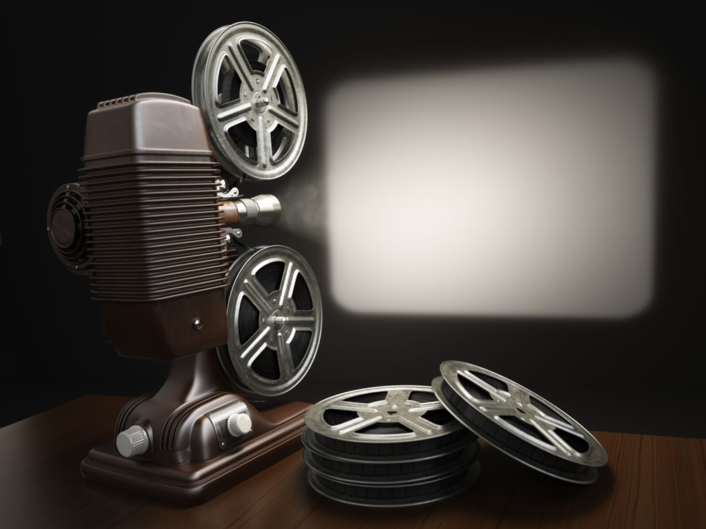 Vintage film projector with reels on table