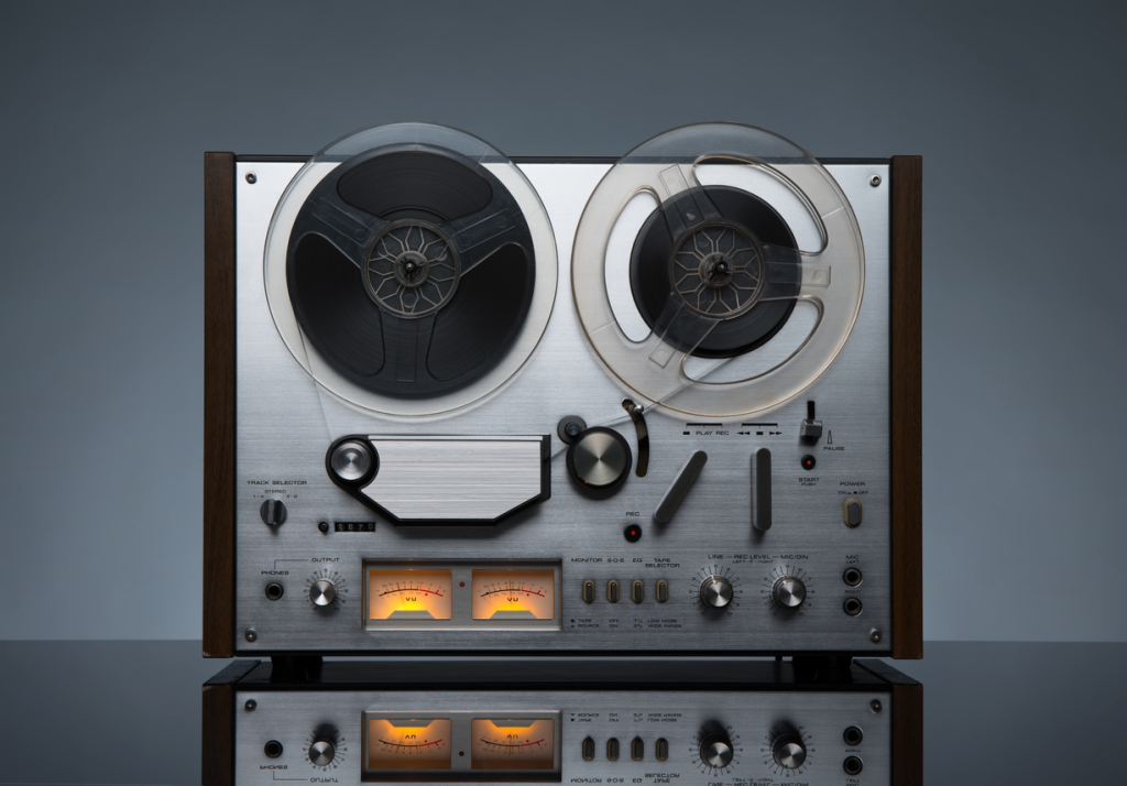 Vintage reel-to-reel tape recorder player.